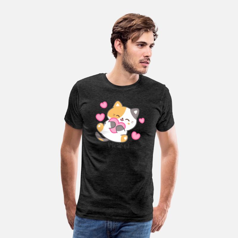Calico cat holding a pink heart